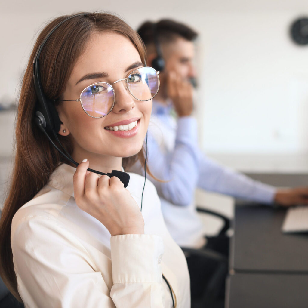 Female technical support agent working in office